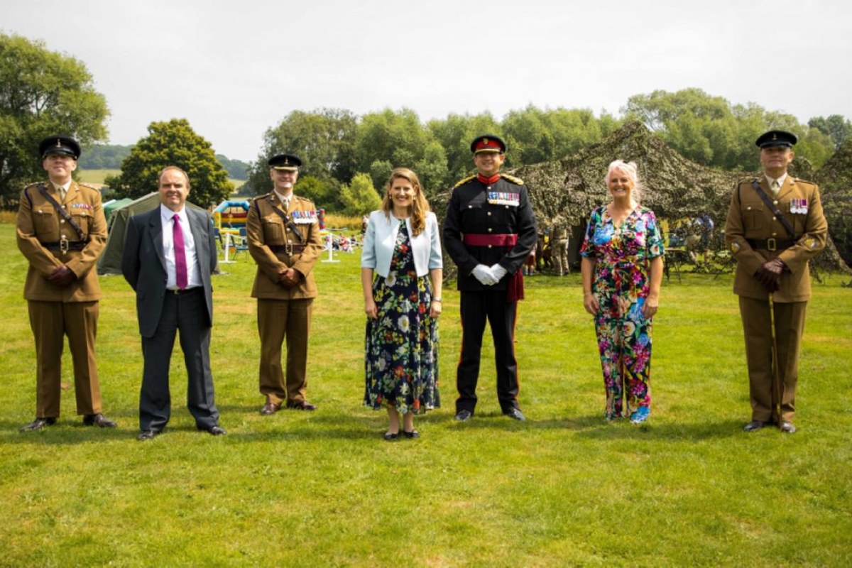 Jules Mitchell with British Army officers at the Commander's Coin presentation